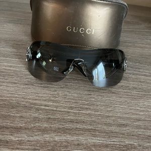 Authentic Gucci sunglasses. Black frame and smoke lenses. Only worn a few times